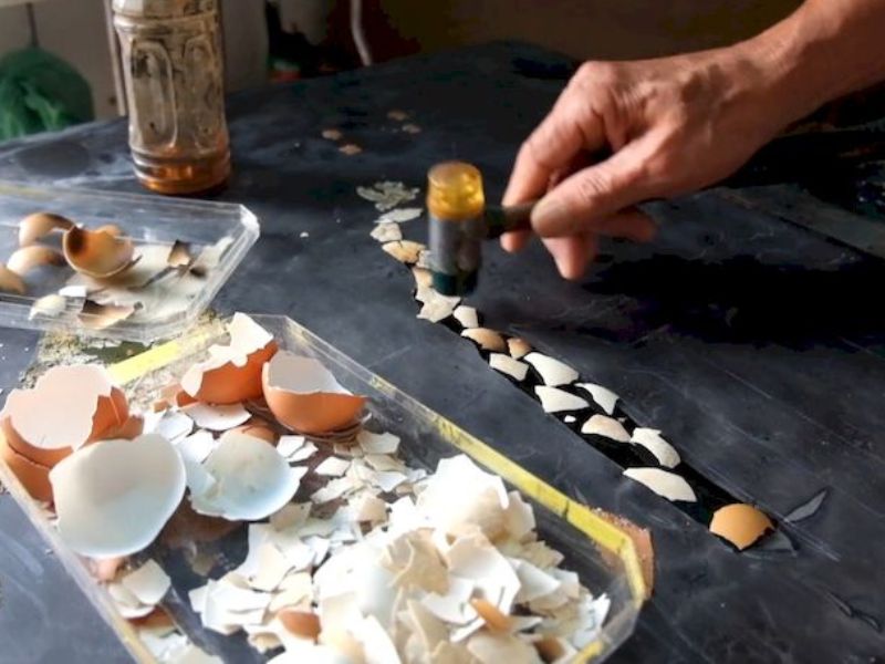 Eggshell inlays contribute delicate, natural white contrasts to traditional lacquer works.